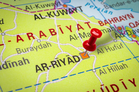 PRAGUE, CZECH REPUBLIC - OCTOBER 28, 2019: Red thumbtack in a map. Pushpin pointing at Riyadth city...