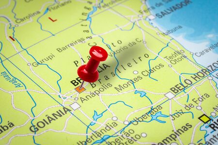 PRAGUE, CZECH REPUBLIC - OCTOBER 28, 2019: Red thumbtack in a map. Pushpin pointing at Brasilia city in Brazil.のeditorial素材
