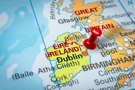 PRAGUE, CZECH REPUBLIC - OCTOBER 28, 2019: Red thumbtack in a map. Pushpin pointing at Dublin city in Ireland.のeditorial素材