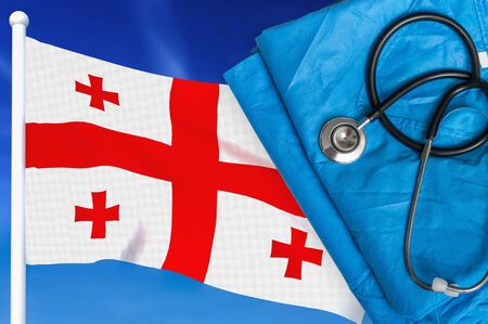 Health care in Georgia. Stethoscope and medical uniform on national flag background.の写真素材