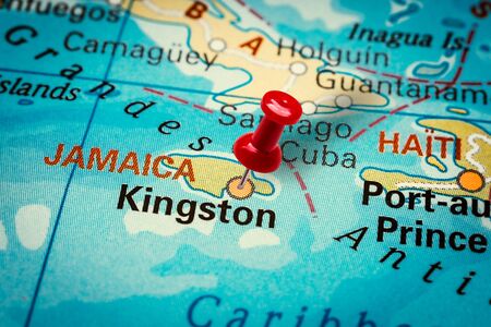 PRAGUE, CZECH REPUBLIC - JANUARY 12, 2019: Red thumbtack in a map. Pushpin pointing at Kingston city in Jamaica.のeditorial素材