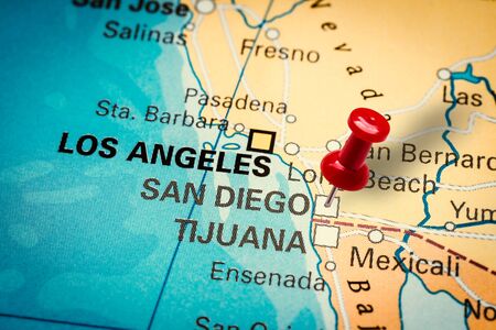 PRAGUE, CZECH REPUBLIC - JANUARY 12, 2019: Red thumbtack in a map. Pushpin pointing at San Diego city in California, America.のeditorial素材