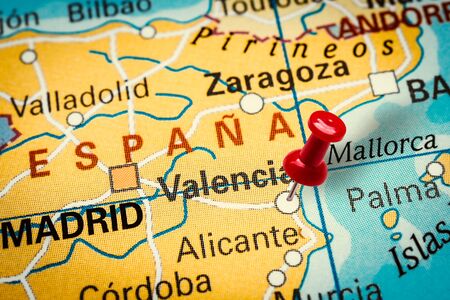 PRAGUE, CZECH REPUBLIC - JANUARY 12, 2019: Red thumbtack in a map. Pushpin pointing at Valencia city in Spain.のeditorial素材