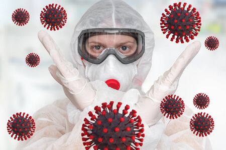 Scientist with FFP3 respirator mask is showing STOP gesture - STOP CORONAVIRUS conceptの写真素材