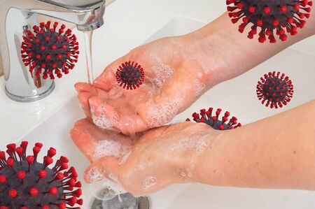 Woman washing hands to prevent spread of COVID-19 - coronavirus conceptの写真素材