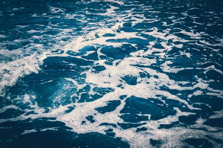Sea waves and foam from a cruise ship - retro styleの写真素材