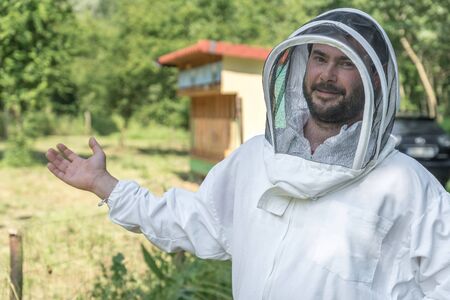 Beekeeper with his bee hiveの写真素材