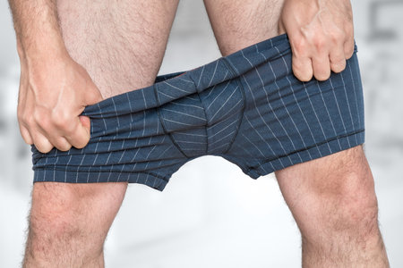 Man puts on or undressing his underpants
