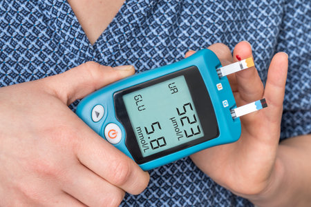 Woman is checking uric acid and sugar level from blood with glucose and uric acid meter