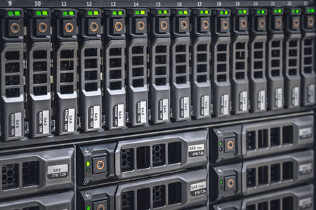 Storage server with many HDD disks inside rack in server room - data center conceptの写真素材