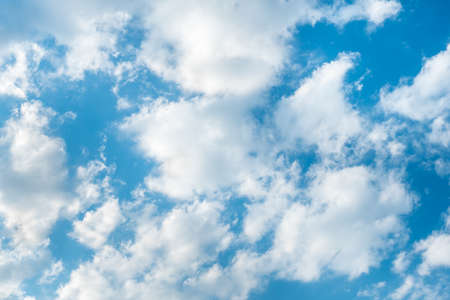 Blue sky background with cloudsの写真素材
