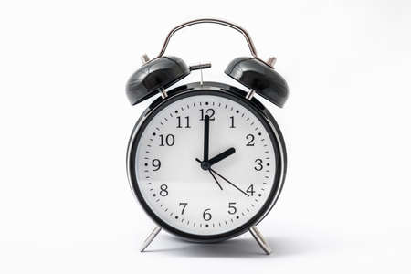 Alarm clock with double bell - winter time and summer time conceptの写真素材