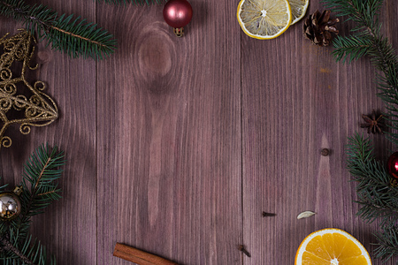Christmas gift box, food decor and fir tree branch on wooden table. Top view with copy spaceの写真素材