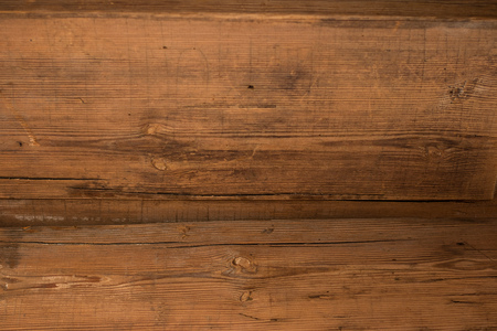Brown walnut wood texture, old rustic surface with skratchesの写真素材
