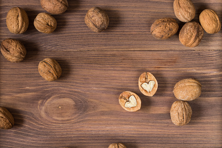 whole walnuts on wooden backgroundの写真素材
