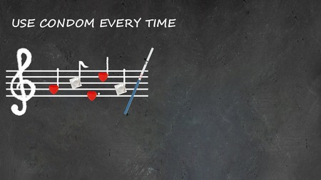 Music note sheet on chalkboard, notes made up with red hearts and mock up condom pack in the end and text USE CONDOM EVERY TIME Creative concept about sexual education, safe sex and health protectionの写真素材