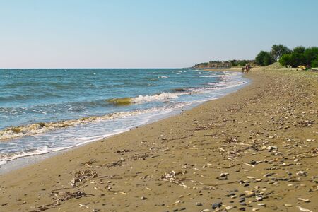Beach view. Seashore texture. line water foam over clean sand and blue water. Hirozontalの写真素材