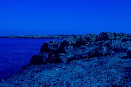Beautiful landscape near of Nissi beach and Cavo Greco in Ayia Napa, Cyprus island, Mediterranean Sea. Horizontal Amazing sea and evening. Classic, blue monochrome, trend 2020の写真素材