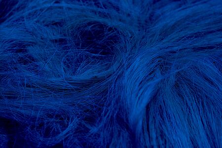 Rough natural raw plant fiber. Detail, closeup. Wallpaper and background about fabtic manufacture, eco friendly material and textile industry. Horizontal. Classic, blue monochrome, trend 2020の写真素材