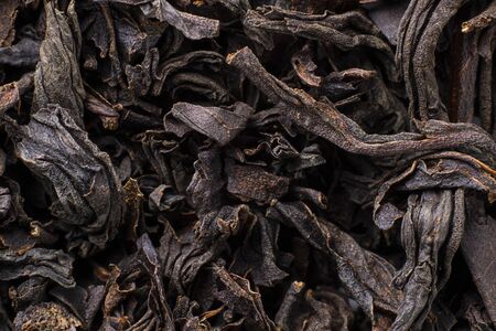 Black tea background. Fermented leaves for meking helthy hot drink. Horizontalの写真素材