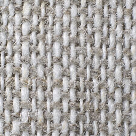 Macro of natural grey white linen textile background. For text or design. Square.の写真素材