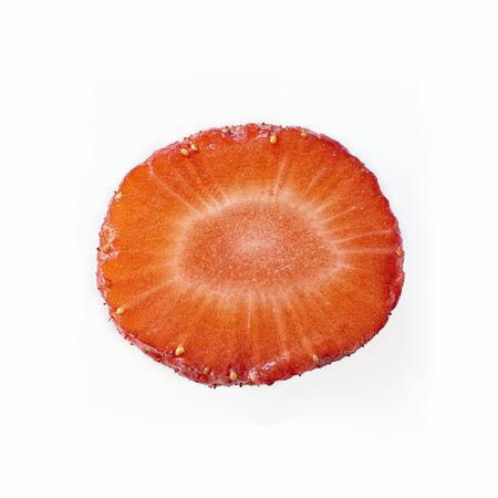 Isolated close up ripe red strawberry cut in half on a white background. Macro square image about fresh organic berries, harvets, healthy food and vitaminの写真素材