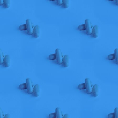 Photographic collage, seamless pattern with Tree Isolated close up pills. Macro. Oval long shape remedies. Blue tone. Background or texture about Medicine, Health, Vitamins which support human bodyの写真素材