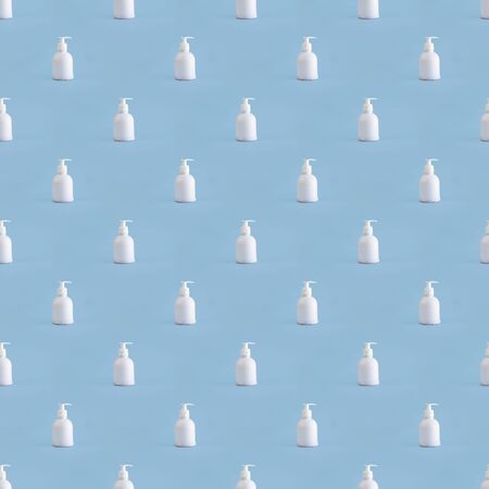Trendy seamless pattern with white plastic mockup dispenser on blue background. Many bottles of hand sanitizer for virus and infection. Antiseptic drug concept Photographic collage. Hygiene and Healthの写真素材