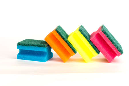 multicolored sponges for washing dishes on white backgroundの写真素材