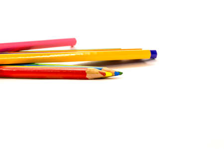 colored pencils are in a different order on a white backgroundの写真素材