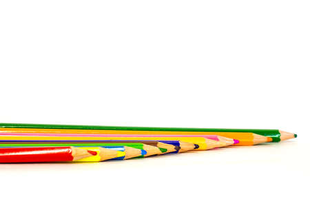 colored pencils are in a different order on a white backgroundの写真素材