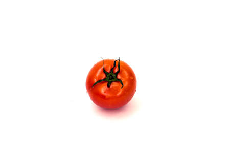 Red tomato with green leaf on white backgroundの写真素材