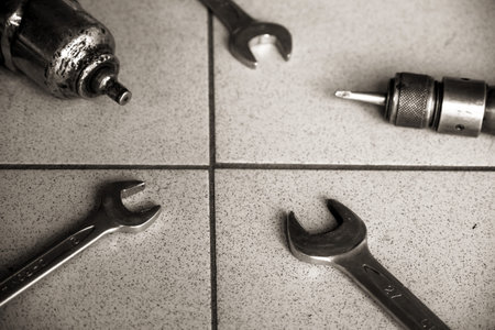 Old Car mechanic to replace and fix tires by top view