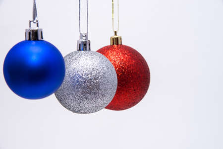 Christmas balls blue red and silver on white backgroundの写真素材