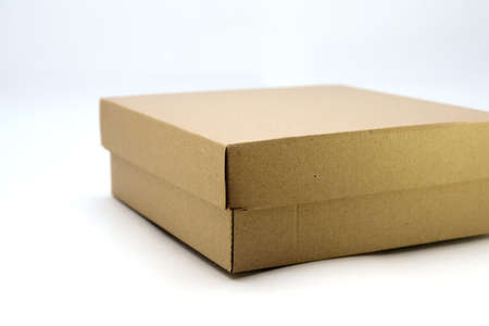 cardboard box with lid lies on white background in different anglesの写真素材