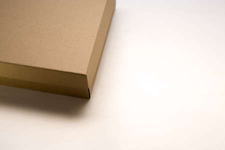 cardboard box with lid lies on white background in different anglesの写真素材