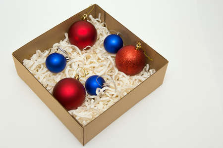 christmas decorations in the box on the white backgroundの写真素材