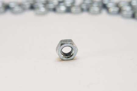 Stainless steel bolt and nut, a shop floor item, shallow DOFの写真素材