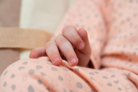 hand newborn close-up in different positions, during sleepの写真素材