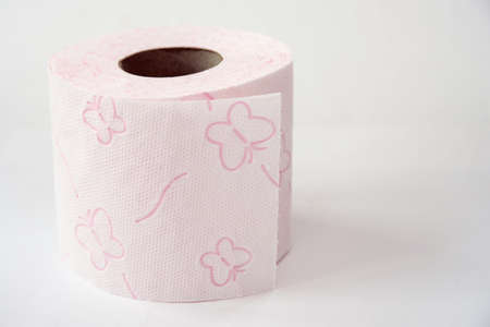 pink toilet paper roll, white background, close-up, butterflies on toilet paper, clean toilet paperの写真素材