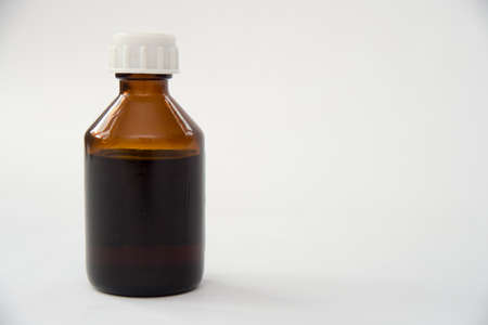 Front view medical glass bottle isolated on whiteの写真素材