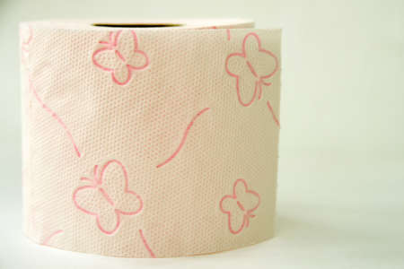 pink toilet paper roll, white background, close-up, butterflies on toilet paper, clean toilet paperの写真素材