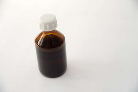 Front view medical glass bottle isolated on whiteの写真素材