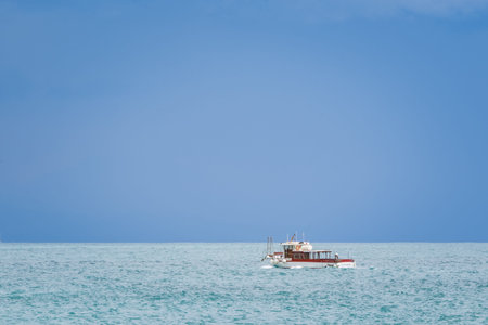 Boat on the Tyrrhenian Sea seen from the Minori and Maiori Beach, Amalfi Coast, Campania, Italy