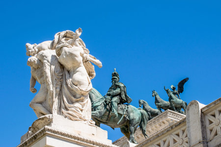 The kiss of the statues in front of Altare della Patria,  Piazza Venezia, Rome Italy
