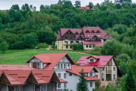 Modern houses on the hills from Bran, Brasov, Romaniaの写真素材