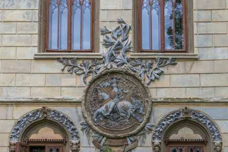 A wall sculpture illustrating a worrier who is riding a horse, Sturdza castle, Miclauseni, Romaniaのeditorial素材