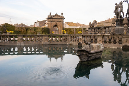 Serene View of Fontana dei Mori with Stone Boat and Reflections at Villa Lante, Bagnaiaの写真素材
