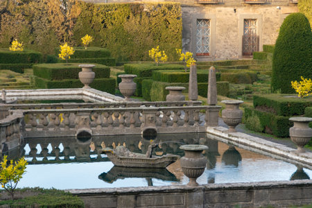 Ornate Stone Fountain with Boat Sculpture and Decorative Urns in the Gardens of Villa Lante, Italyの写真素材