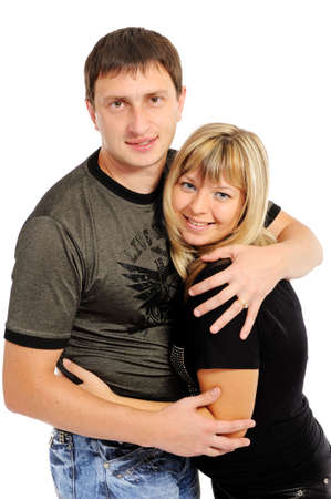 On a white background the enamoured pair embracesの写真素材
